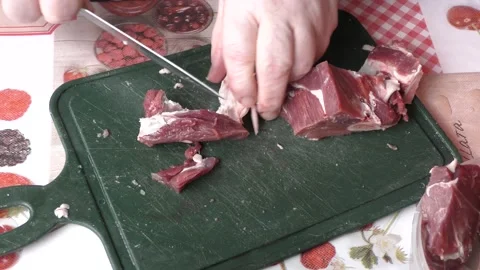 Chef cuts deer meat with a knife, healthy food concept Stock Footage 154444111