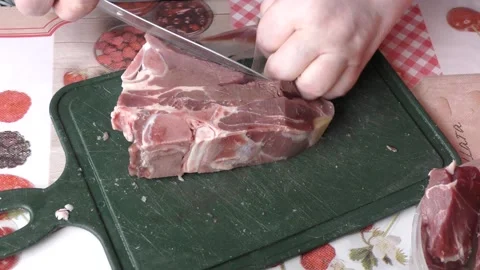 Chef cuts deer meat with a knife, healthy food concept Stock Footage 154444505