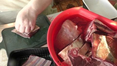 The chef cuts deer meat with a knife Stock Footage 164276799