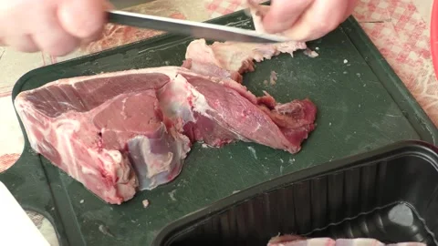 The chef cuts deer meat with a knife Stock Footage 164276921