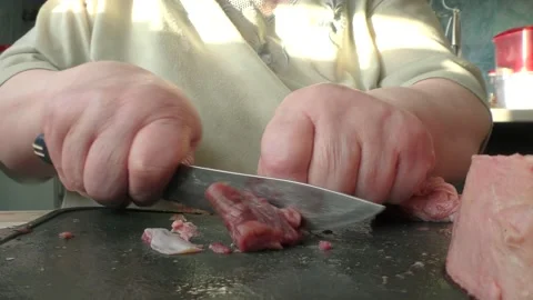 The chef cuts deer meat with a knife Stock Footage 164277937