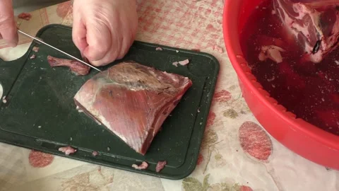 The chef cuts deer meat with a knife Stock Footage 164278292