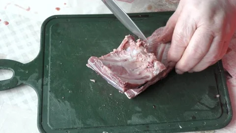 The chef cuts deer meat with a knife Stock Footage 164287710
