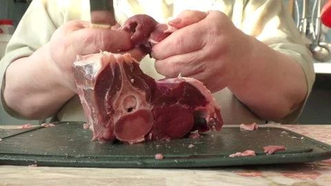 The chef cuts deer meat with a knife Stock Footage 166334910