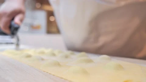 Chef cuts the dough for pasta Stock Footage 131313460
