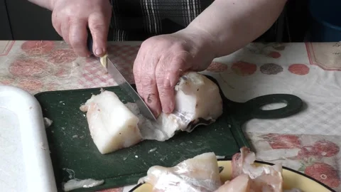 The chef cuts the fillet of cod fish Stock Footage 170173303