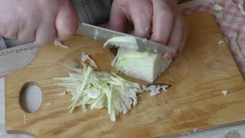 Chef cuts fresh cabbage with a knife Stock Footage 170935816