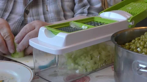 The chef cuts a fresh cucumber Stock Footage 187641792