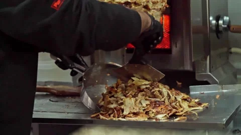 Chef cuts fried meat Stock Footage 188462511