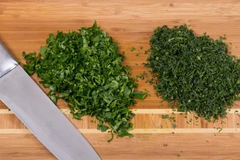The chef cuts the greens Stock Photos