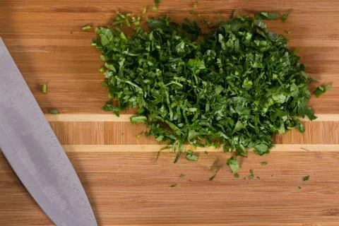 The chef cuts the greens Stock Photos