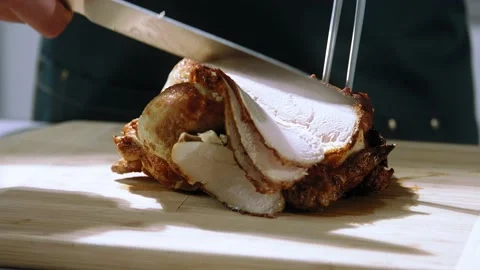 Chef cuts the grilled chicken slow motion Stock Footage 153767002