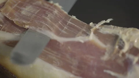 Chef cuts ham, macro shot, 4k Video stock 143655783