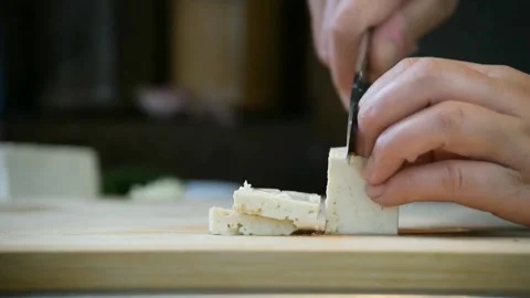 Chef cuts to it with a sharp knife Stock Footage 151663133