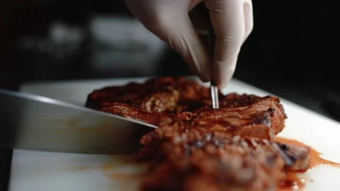 Chef cuts juicy steak. Stock Footage 145855759