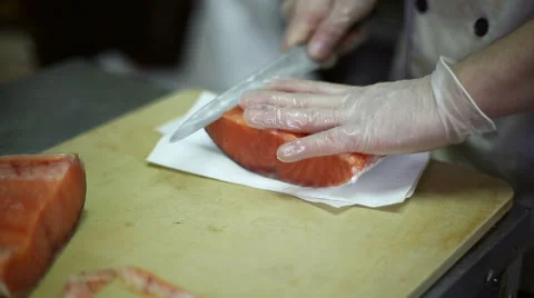 The chef cuts knife a fillet of red fish Stock Footage 59698738
