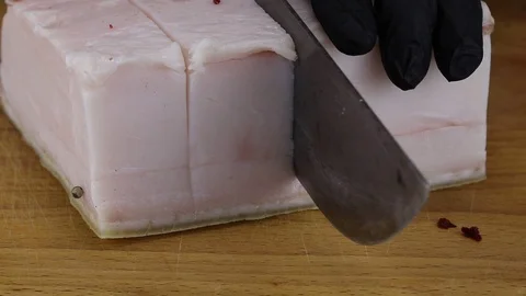 A chef cuts with a large knife Stock Footage 121746004