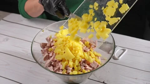 The chef cuts large potatoes for the olivier salad. High quality 4k footage Stock Footage 291683031