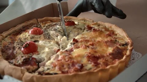 The chef cuts the lasagna with a knife Stock Footage 137828040