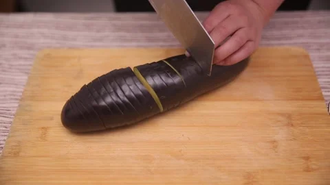 Chef cuts long eggplant (1) Stock Footage 202166785
