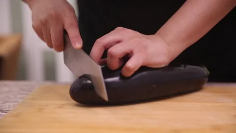 Chef cuts long eggplant (3) Stock Footage 202166810