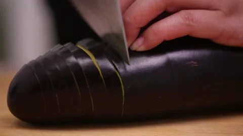 Chef cuts long eggplant (4) Stock Footage 202166812