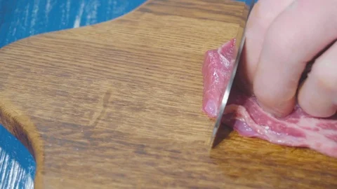 Chef cuts meat close up Stock Footage 73816361