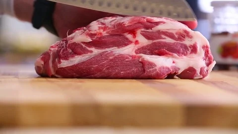 The chef cuts meat close up Stock Footage 74427947