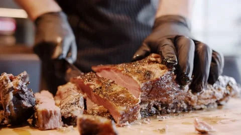 Chef cuts meat Stock Footage 143392229