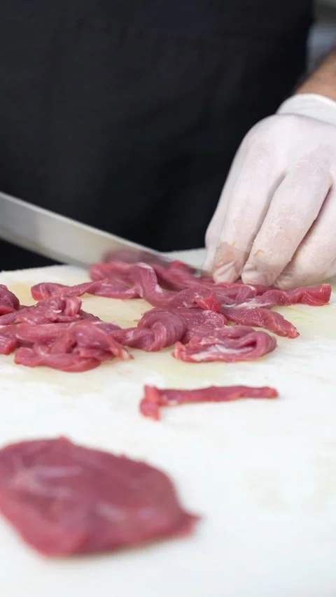 Chef Cuts Meat With Knife Stock Footage 296023320