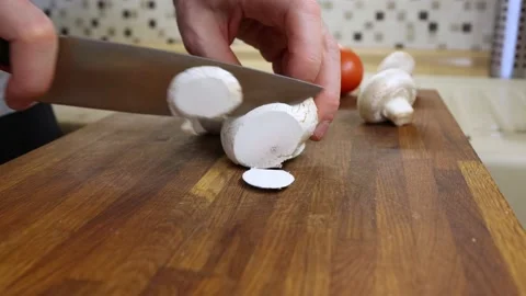 The chef cuts the mushrooms Stock Footage 156692910