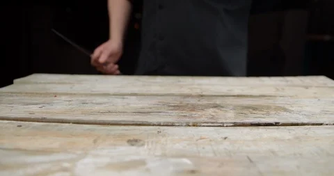 The chef cuts the onion in half on the Board Video stock 113423522