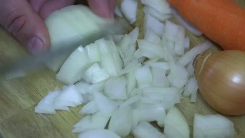 The chef cuts onions for cooking dinner, on a cutting board Vídeos de archivo 221736675