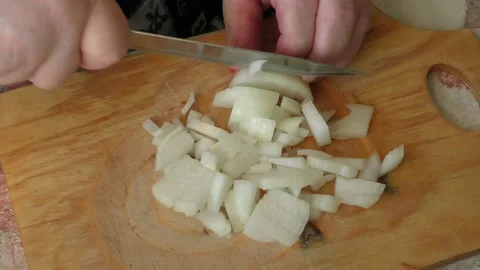The chef cuts onions with a knife Stock Footage 165151081