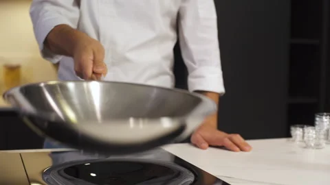 Chef Cuts Onions In Restaurant Kitchen On Cutting Board. Cooking Food. Stock-Footage 142817738