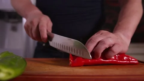 Chef cuts pepper and green pepper (1) Stock Footage 202206033