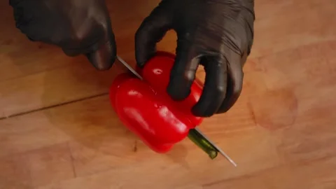 Chef cuts peppers in the kitchen. Close up Stock Footage 131152076