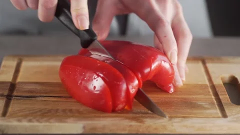 Chef cuts peppers for making vegetable dish fresh vegetable salad Video stock 143777130