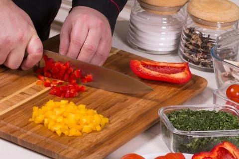 The chef cuts the peppers Stock Photos