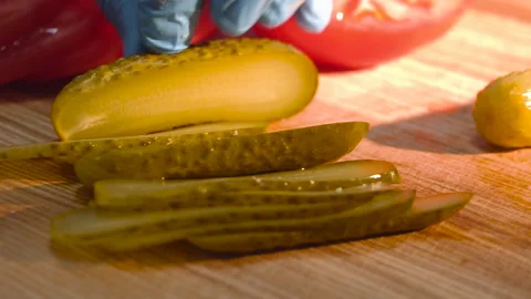 The chef cuts the pickled cucumbers into slices Stock Footage 158021642