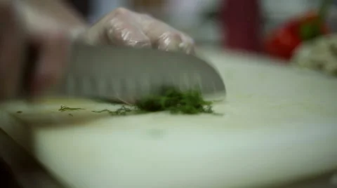 The chef cuts into pieces dill Stock Footage 59699789