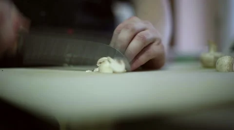 The chef cuts into pieces mushrooms Stock Footage 59699650