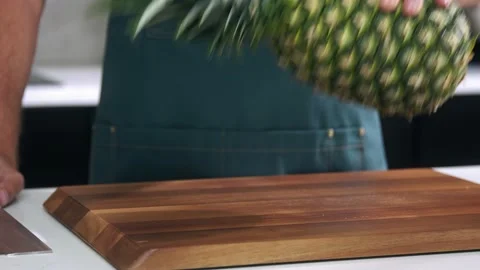 Chef cuts the pineapple slow motion Stock Footage 223220526