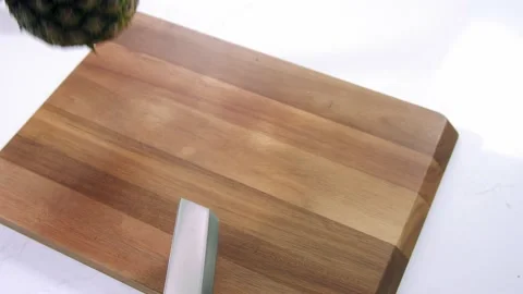 Chef cuts the pineapple slow motion Stock-Footage 223583303