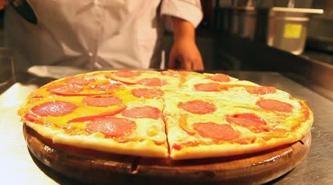 Chef cuts pizza Stock Footage 8986688