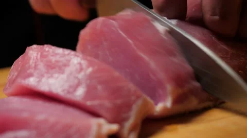 The chef cuts pork fillet Video stock 143391795