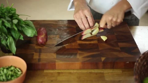 Chef cuts a potato with knife skills Stock Footage 59889715
