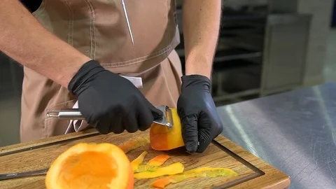 The chef cuts a pumpkin Stock Footage 97880848