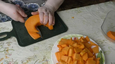 The chef cuts the pumpkin with a knife Stock Footage 139131903