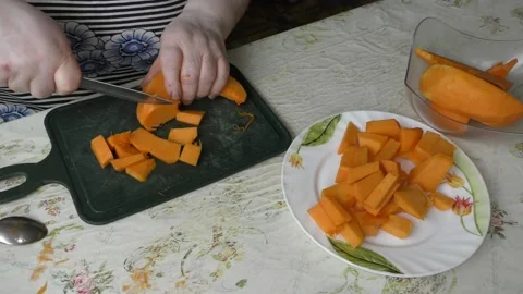 The chef cuts the pumpkin with a knife Stock Footage 139132029